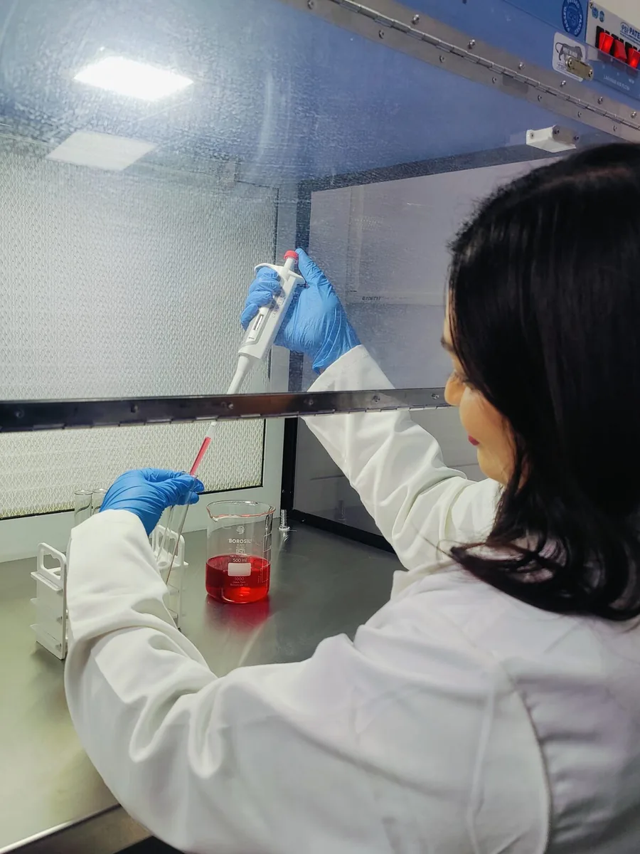 UKHI R&D lab technician handling formulation samples